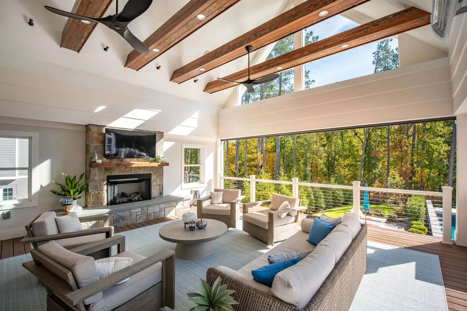 view of pool and back yard from sun room