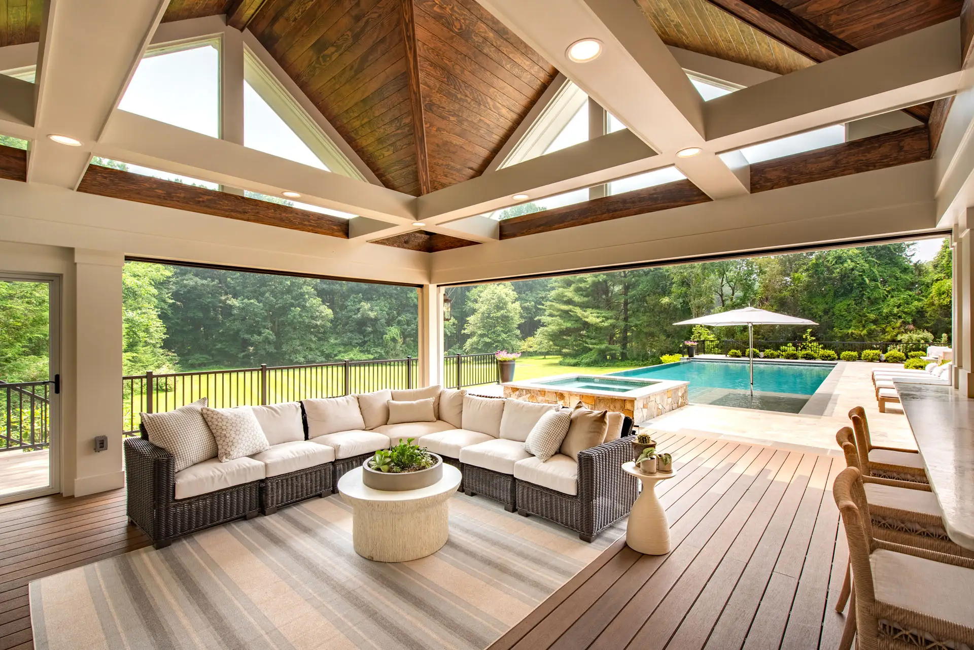 couch, bar, and view of pool