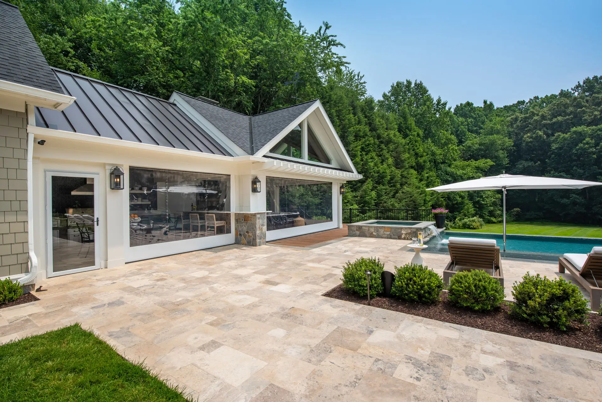 view of sunroom with closed covers and window