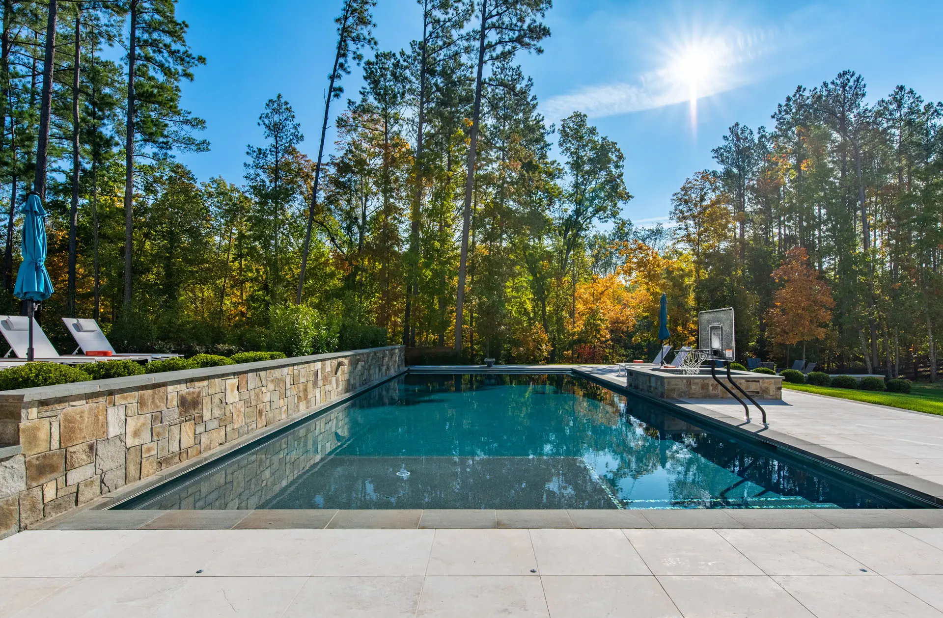 pool with basketball hoop